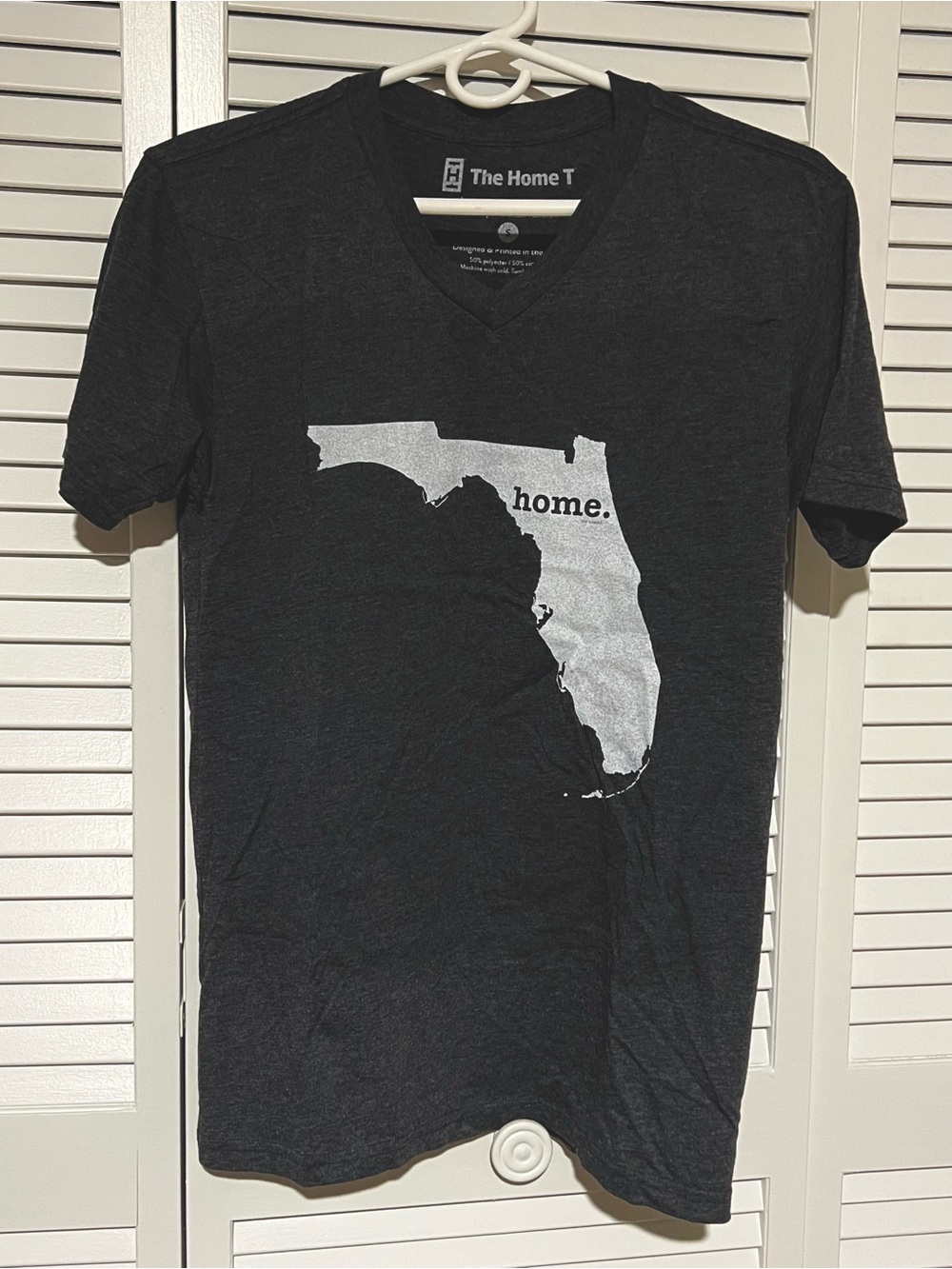 The Home T Women’s Black V-Neck Tee with Silver Florida 'home.' Graphic